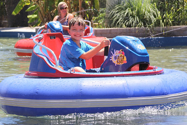 kid riding bumper boat