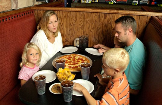 family at pizza restaurant