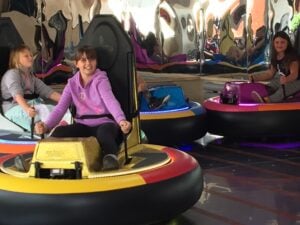 kids in amusement park ride