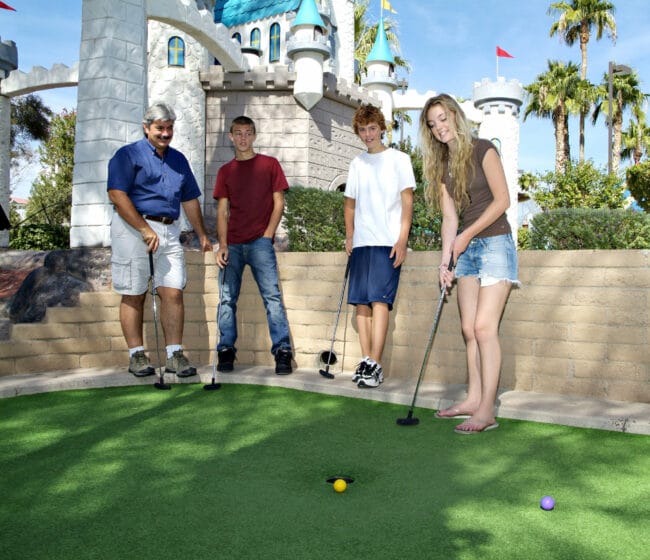 family playing goofy golf