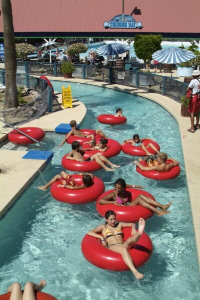 people floating down lazy river in water park