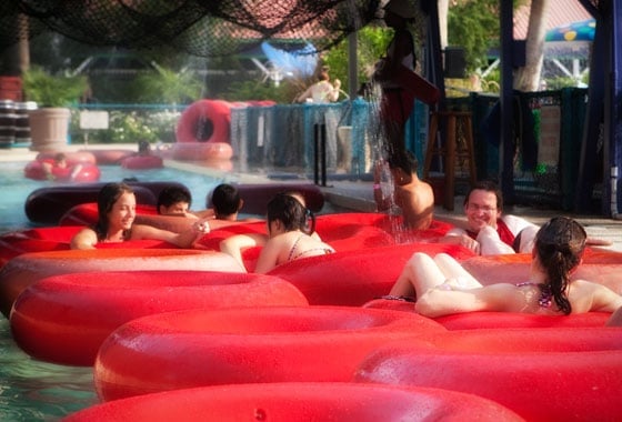 families floating down water park lazy river