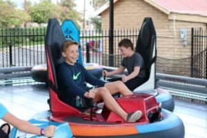 kid riding bumper car