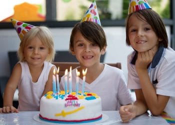 kids at a birthday party with cake