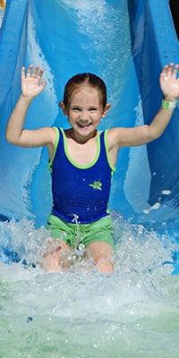 Girl on water slide at emerald hills golfland in san jose